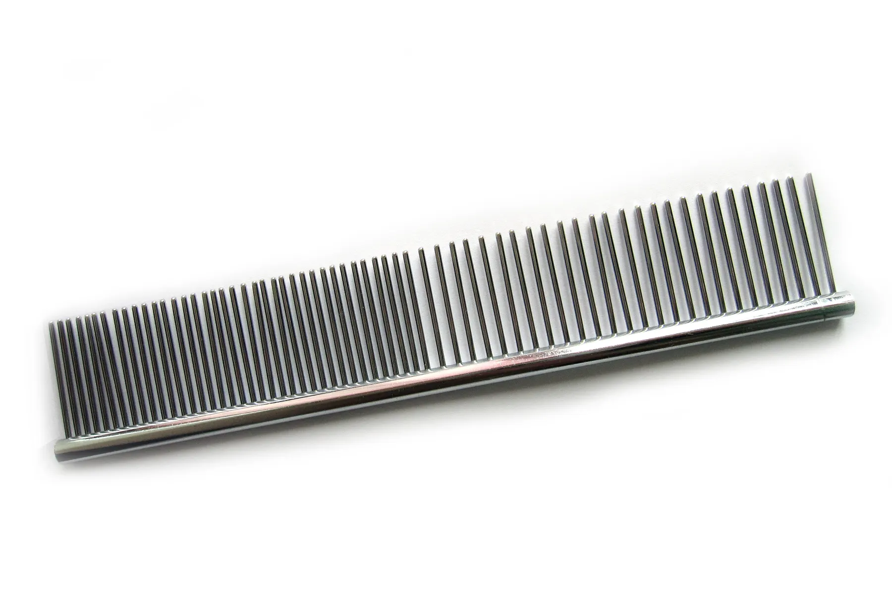A fine-toothed grooming comb resting on a clean white surface